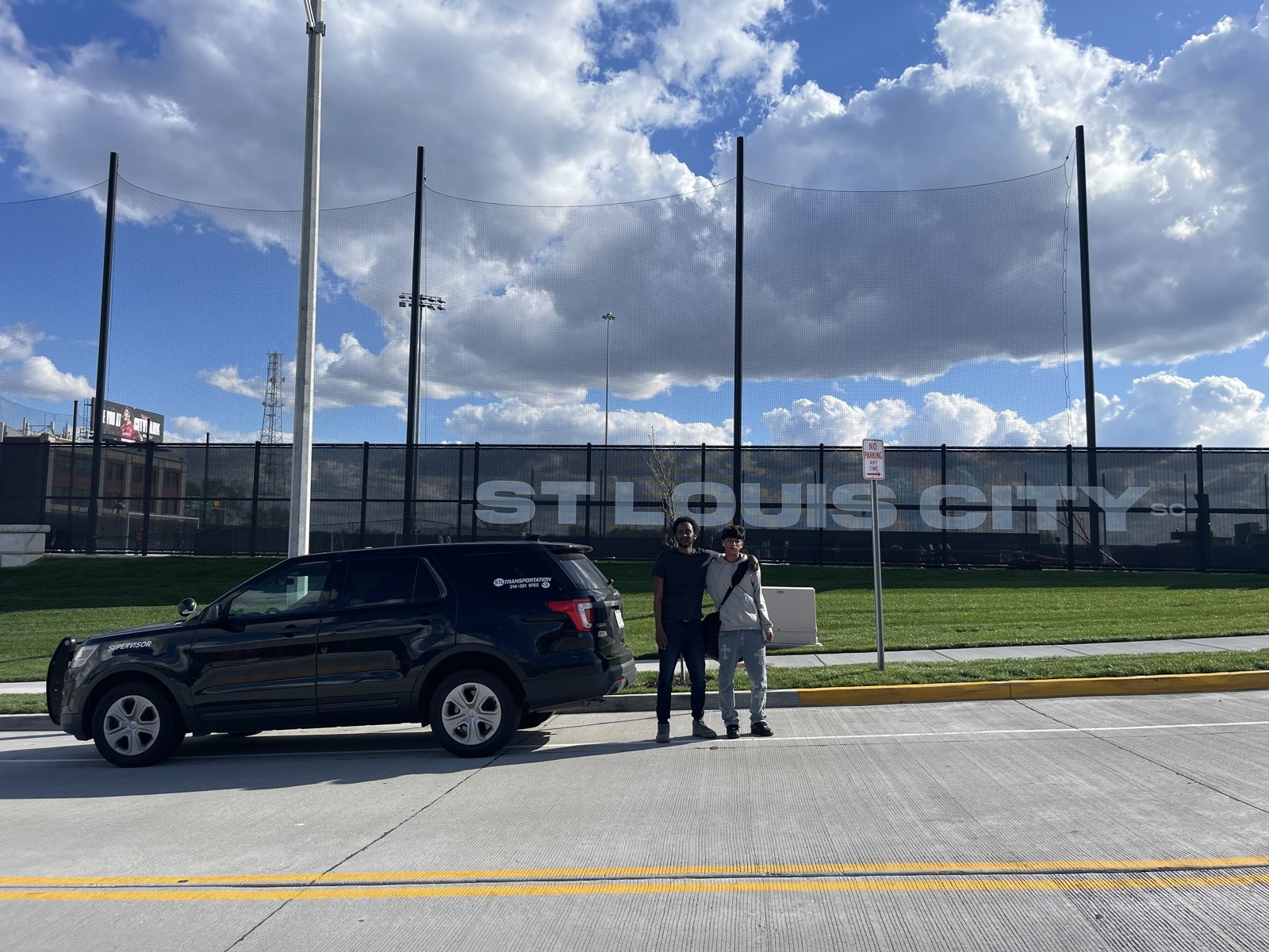 STL Transportation supervisor with a student at CITYPARK stadium